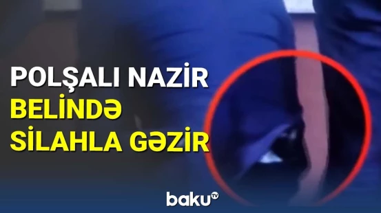 Polşalı nazir belində silahla gəzir