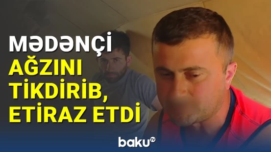 Gürcüstanda etirazçı ağzını tikdirib