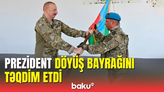 İlham Əliyev hərbi hissə komandirinə döyüş bayrağını təqdim etdi