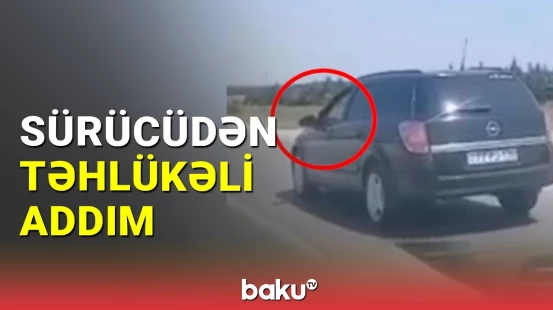 Avtomobili ayağını pəncərədən çıxararaq idarə etdi