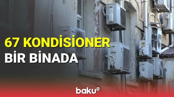 Bakıda tarixi binanın görünüşünü pozan kondisionerlər