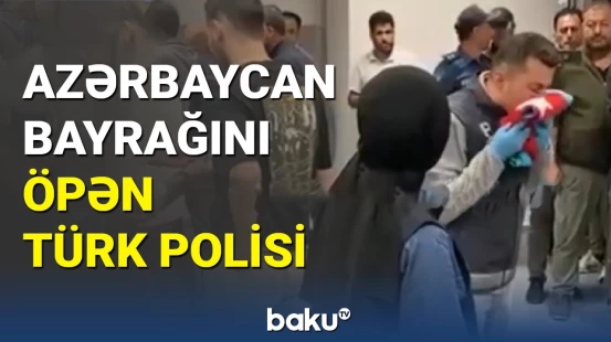 Türk polisi Türkiyə-Ermənistan matçından öncə Azərbaycan bayrağını öpüb təslim aldı