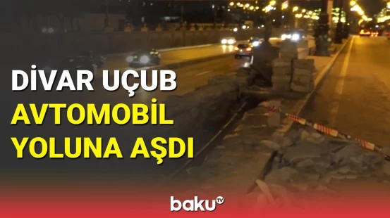 Bakıda təhlükəli vəziyyət: yük avtomobili çırpılan divar aşdı