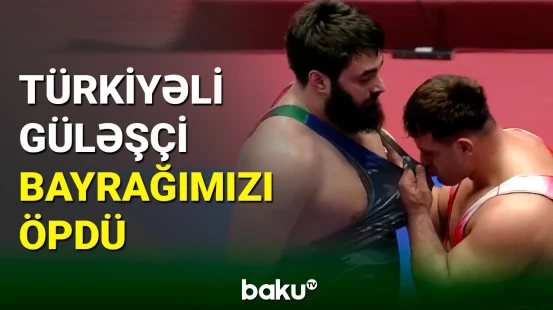 Türkiyəli güləşçi Rza Kayaalp Azərbaycan bayrağını öpdü