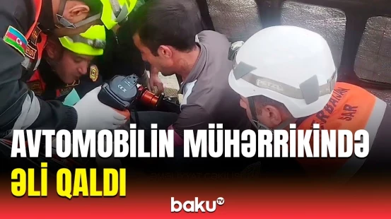FHN avtomobilin mühərrikində əli qalan şəxsi belə xilas etdi
