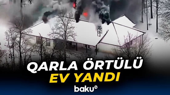 ABŞ-də qarla örtülü ev alovlandı