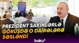 Prezident İlham Əliyev Zəngilan şəhərindəki ilk yaşayış kompleksinə köçən ailələrlə görüşüb