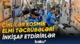 Astronavtlar robot köməkçi ilə əməkdaşlıq edirlər